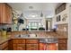 Kitchen featuring granite countertops and a convenient breakfast bar at 15149 E Princeton Pl # B, Aurora, CO 80014