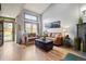Bright living room with wood floors, high ceilings, and a charming view at 15149 E Princeton Pl # B, Aurora, CO 80014