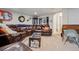 Basement living room featuring a leather sofa and warm decor at 15149 E Princeton Pl # B, Aurora, CO 80014