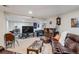 Basement living room with a large sectional sofa, television, and casual decor at 15149 E Princeton Pl # B, Aurora, CO 80014