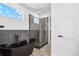 Modern bathroom features a freestanding tub and a separate glass-enclosed shower at 995 Pinehurst Ct, Bennett, CO 80102