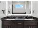 Modern bathroom featuring granite countertop and illuminated mirror at 995 Pinehurst Ct, Bennett, CO 80102