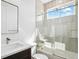 Bathroom featuring shower over tub with marble tile surround at 995 Pinehurst Ct, Bennett, CO 80102
