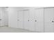 A bedroom features multiple closets, fresh paint, and carpeted floors at 995 Pinehurst Ct, Bennett, CO 80102