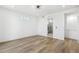 Spacious, bright bedroom with hardwood floors, recessed lighting, and access to an en-suite bathroom at 995 Pinehurst Ct, Bennett, CO 80102