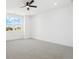 Bright bedroom featuring neutral carpeting and windows with views at 995 Pinehurst Ct, Bennett, CO 80102