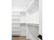 Walk-in closet with built-in shelving units for optimal storage and organization at 995 Pinehurst Ct, Bennett, CO 80102