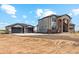 Modern home featuring stone accents, a paved driveway, and a two-car garage at 995 Pinehurst Ct, Bennett, CO 80102