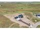 Exterior view of new construction home with three car garage on a large lot in an open community at 995 Pinehurst Ct, Bennett, CO 80102