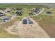 Overhead view of new construction home with a three car garage and spacious lot in quiet community at 995 Pinehurst Ct, Bennett, CO 80102