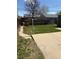 Backyard features a small yard with a clothesline and access to a concrete patio at 1516 S Lowell Blvd, Denver, CO 80219