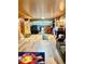 Spacious basement with wood paneled walls, wood flooring, and closet at 1516 S Lowell Blvd, Denver, CO 80219