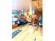 Basement featuring wood flooring, wood paneled walls, and sitting area at 1516 S Lowell Blvd, Denver, CO 80219