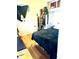 Cozy bedroom with hardwood floors, simple decor, and a comfortable bed at 1516 S Lowell Blvd, Denver, CO 80219