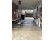 Patio features a picnic table, concrete floors, privacy lattice, and access to the backyard at 1516 S Lowell Blvd, Denver, CO 80219