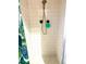 Enclosed shower with a shower head, green exfoliating sponge, and tiled walls at 1516 S Lowell Blvd, Denver, CO 80219