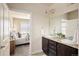 Ensuite bathroom with double sinks and access to the main bedroom at 303 Inverness S Way # 101, Englewood, CO 80112