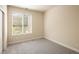 Bright bedroom with a large window offering natural light and a neutral color scheme at 303 Inverness S Way # 101, Englewood, CO 80112