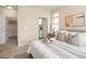Comfortable bedroom with a view into the ensuite bathroom and walk-in closet at 303 Inverness S Way # 101, Englewood, CO 80112