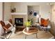 Comfortable living room with fireplace and stylish decor, creating a welcoming space at 303 Inverness S Way # 101, Englewood, CO 80112