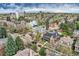 An aerial view of the neighborhood showcasing its mature trees and proximity to the city at 680 N Emerson St, Denver, CO 80218