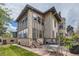 Charming two-story home with brick exterior, patio, and lush backyard at 680 N Emerson St, Denver, CO 80218