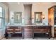 Stylish bathroom with dual vanities, modern lighting fixtures, and ample storage space at 680 N Emerson St, Denver, CO 80218