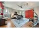 Spacious bedroom features hardwood floors, large windows, modern lighting, and stylish decor at 680 N Emerson St, Denver, CO 80218