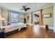 Comfortable bedroom featuring hardwood floors, lots of natural light and an open adjoining room at 680 N Emerson St, Denver, CO 80218