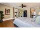 Spacious bedroom featuring hardwood floors, a ceiling fan, and easy access to a large closet at 680 N Emerson St, Denver, CO 80218