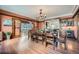 Elegant dining room with hardwood floors, stylish chandelier, and seamless access to the outdoors at 680 N Emerson St, Denver, CO 80218