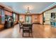 Formal dining room with hardwood floors, a chandelier and adjoining room at 680 N Emerson St, Denver, CO 80218
