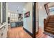 Hallway view leading to a well-equipped kitchen and a staircase at 680 N Emerson St, Denver, CO 80218