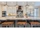 Kitchen island featuring granite countertops, barstool seating, and modern appliances at 680 N Emerson St, Denver, CO 80218