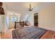 Light filled landing with classic railings, skylight, and decorative chandelier at 680 N Emerson St, Denver, CO 80218