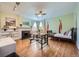 Bright living room features hardwood floors, fireplace, custom built-ins, and lots of natural light at 680 N Emerson St, Denver, CO 80218