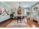 Stylish living room with a modern chandelier, comfortable seating, and ample natural light at 680 N Emerson St, Denver, CO 80218