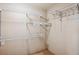 Walk-in closet with ample shelving and hanging space at 9543 Pearl Cir # 101, Parker, CO 80134