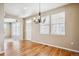 Dining room with hardwood floors and a view into the kitchen at 9543 Pearl Cir # 101, Parker, CO 80134