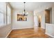 Spacious dining area with hardwood floors and chandelier at 9543 Pearl Cir # 101, Parker, CO 80134