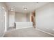 Upstairs hallway with neutral wall colors and carpet at 9543 Pearl Cir # 101, Parker, CO 80134