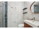 Contemporary bathroom featuring a sleek shower with built-in shelves and modern vanity at 1512 Larimer St # 39, Denver, CO 80202
