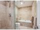Elegant bathroom featuring a tiled shower, tub, and modern fixtures at 1512 Larimer St # 39, Denver, CO 80202