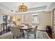 Bright dining area with wood table, stylish rug, and decorative light fixture at 1512 Larimer St # 39, Denver, CO 80202