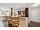 Modern kitchen boasts dark wood cabinets, granite countertops, stainless steel appliances, and bar seating at 1512 Larimer St # 39, Denver, CO 80202