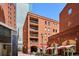 Writer Square's brick buildings, balconies, and outdoor cafes provide a vibrant urban atmosphere in Denver at 1512 Larimer St # 39, Denver, CO 80202