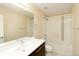 Bright bathroom featuring shower-tub combination and modern vanity at 3390 Cranston Cir, Highlands Ranch, CO 80126