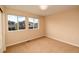 Bedroom with two large windows providing plenty of natural light at 3390 Cranston Cir, Highlands Ranch, CO 80126
