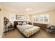 This bedroom features neutral walls, carpet floors, plantation shutters and a decorative light fixture at 3390 Cranston Cir, Highlands Ranch, CO 80126