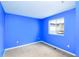 Bedroom with a window providing natural light and beige carpeting at 3390 Cranston Cir, Highlands Ranch, CO 80126